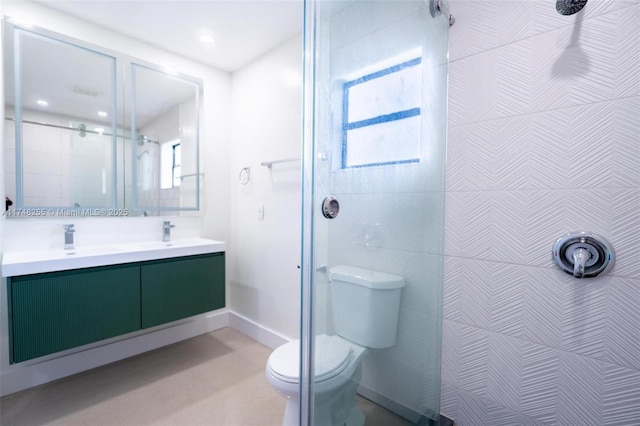 28451 SW 164th Ave, Homestead, FL 33033 - full bathroom with toilet, tiled shower, double vanity, and baseboards