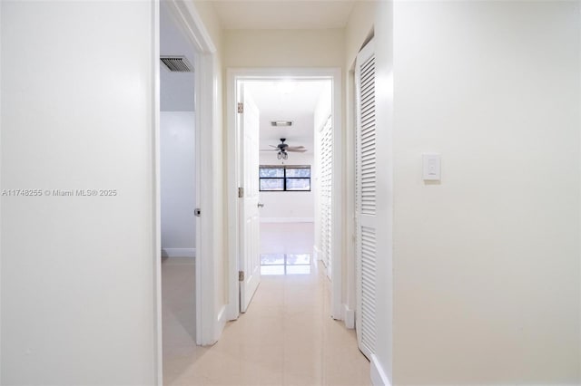 28451 SW 164th Ave, Homestead, FL 33033 - hallway featuring light tile patterned flooring and baseboards