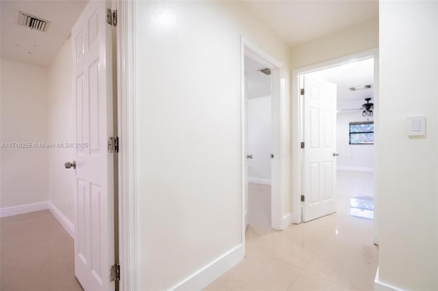 28451 SW 164th Ave, Homestead, FL 33033 - corridor featuring baseboards and light tile patterned floors