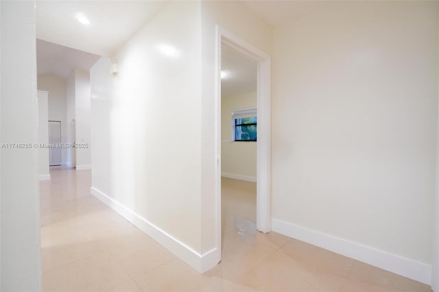 28451 SW 164th Ave, Homestead, FL 33033 - corridor with baseboards and light tile patterned floors