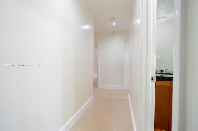 28451 SW 164th Ave, Homestead, FL 33033 - hallway with light tile patterned flooring and baseboards