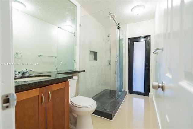 28451 SW 164th Ave, Homestead, FL 33033 - full bath featuring tile patterned flooring, a textured ceiling, a shower stall, vanity, and toilet