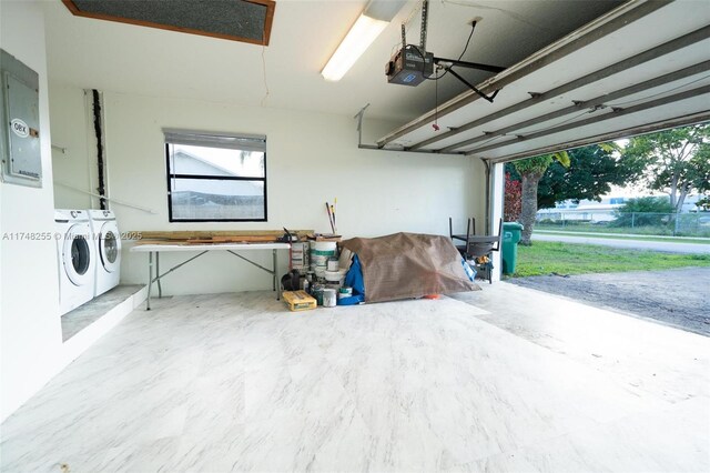 28451 SW 164th Ave, Homestead, FL 33033 - garage with washer and clothes dryer, a garage door opener, and electric panel
