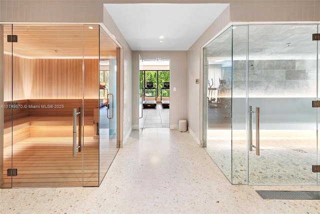 bathroom featuring baseboards and speckled floor