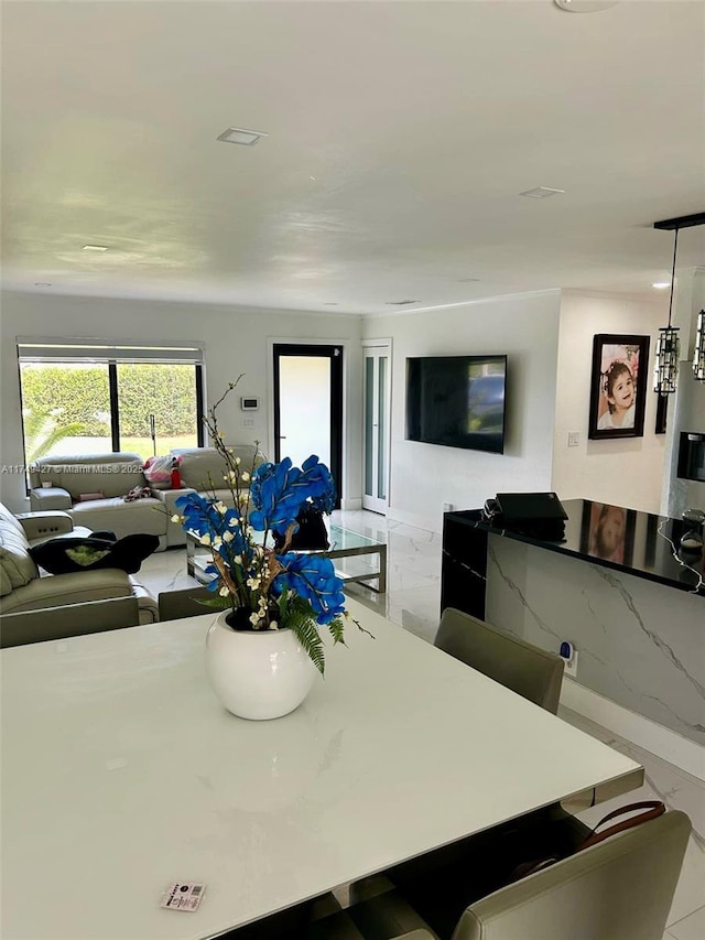 dining room featuring marble finish floor