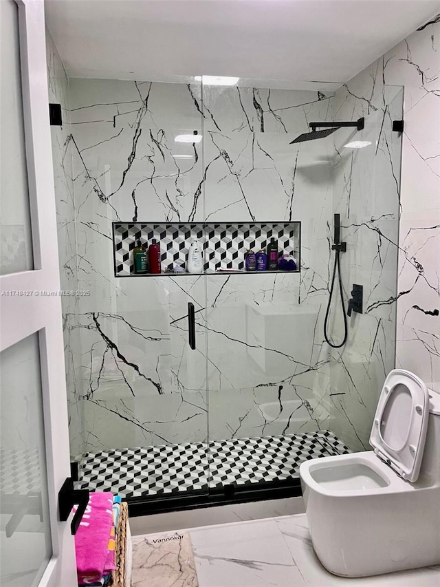 full bath with marble finish floor, a shower stall, and toilet