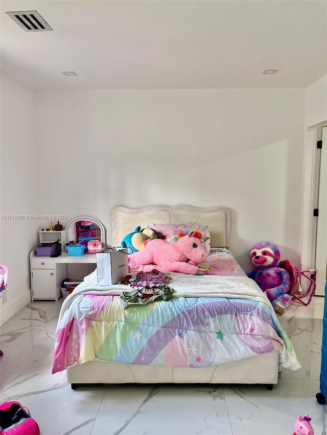 bedroom featuring marble finish floor and visible vents