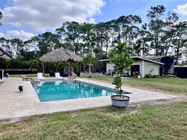 pool featuring an outbuilding, a gazebo, a yard, and a patio