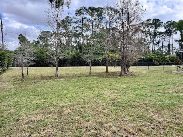 view of yard with fence