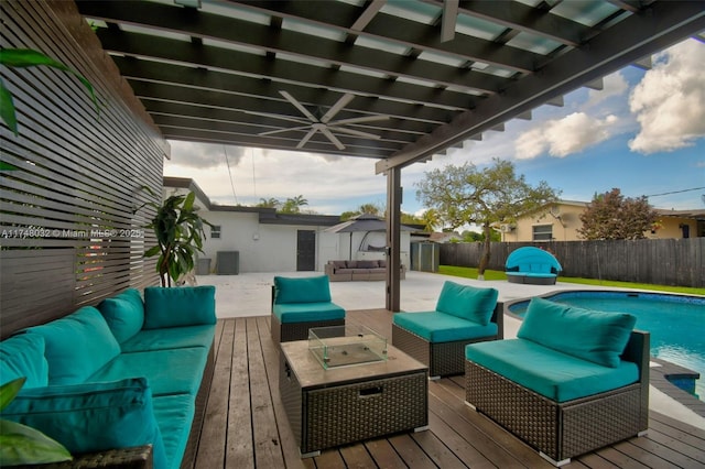 deck with a fenced in pool, central AC, a fenced backyard, and an outdoor living space