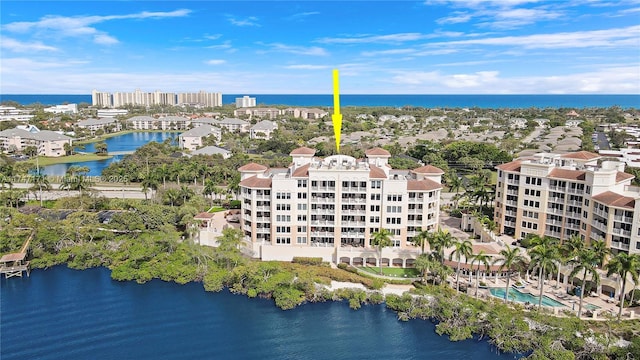 birds eye view of property with a water view