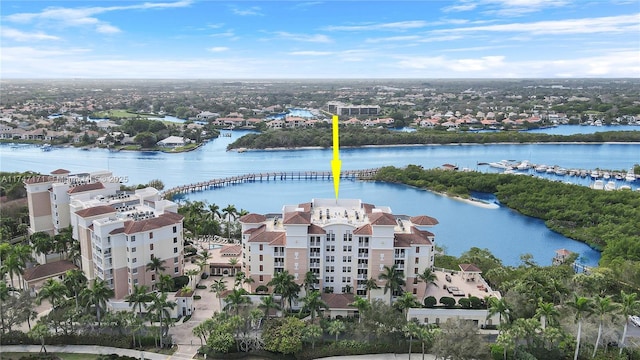 birds eye view of property with a water view