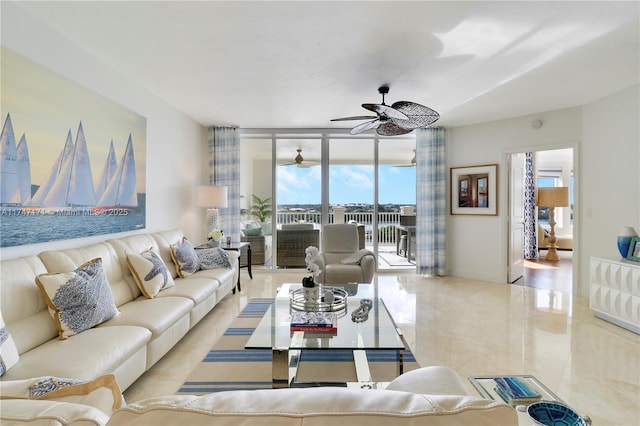 living area with baseboards, floor to ceiling windows, and a ceiling fan