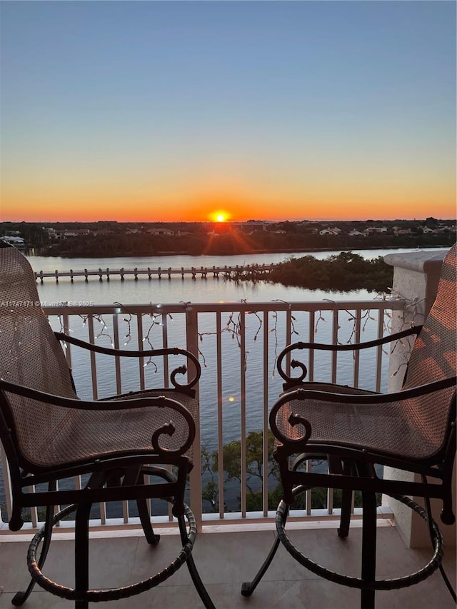 balcony at dusk with a water view