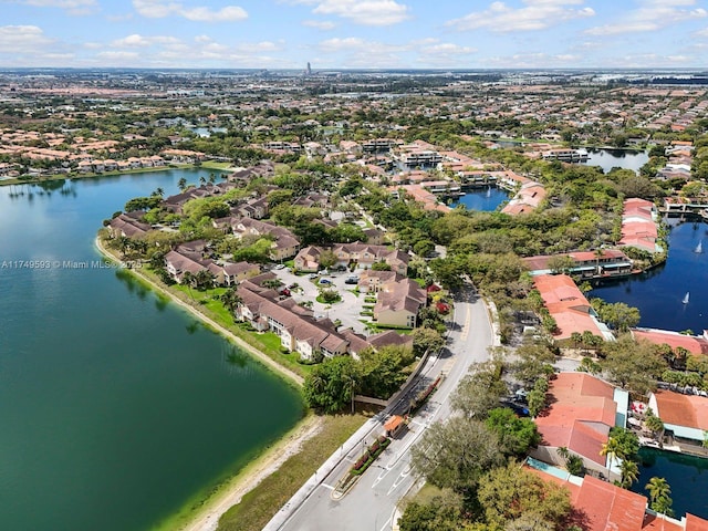 bird's eye view with a water view and a residential view