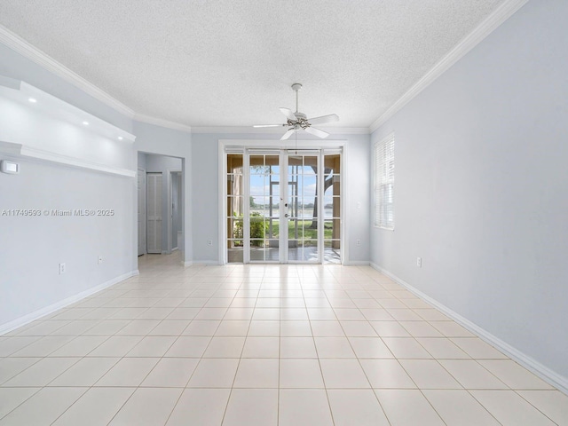 unfurnished room featuring french doors, crown molding, light tile patterned floors, a textured ceiling, and baseboards