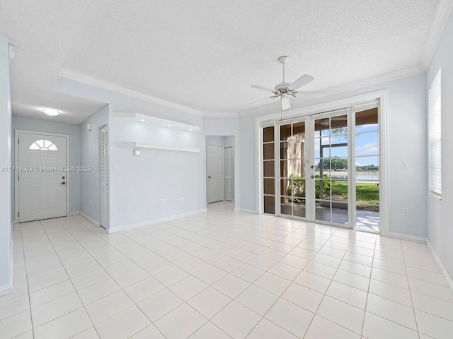 spare room featuring light tile patterned floors, a textured ceiling, and crown molding