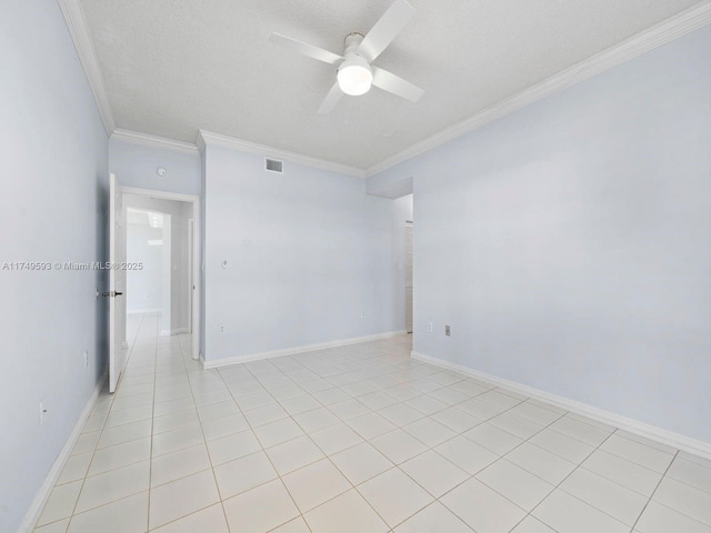 empty room with crown molding, visible vents, a ceiling fan, a textured ceiling, and baseboards