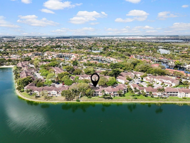 birds eye view of property with a water view and a residential view