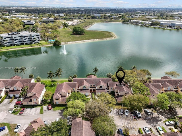 bird's eye view featuring a water view and a residential view