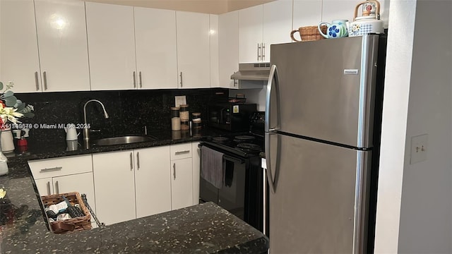 kitchen with black appliances, under cabinet range hood, white cabinets, and a sink