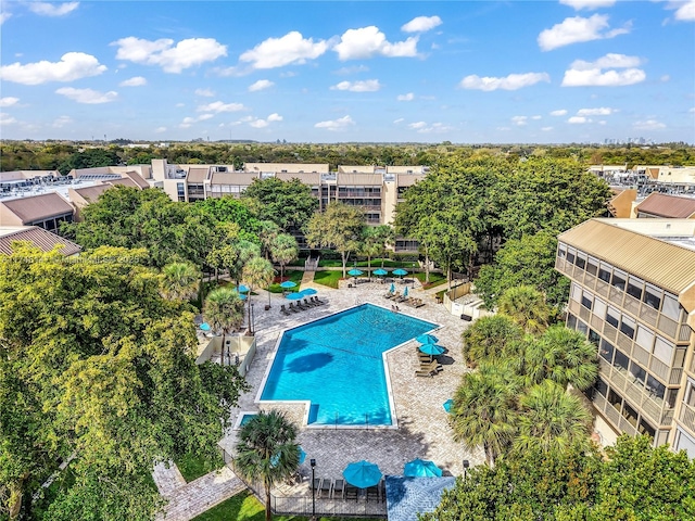 community pool featuring a patio and fence