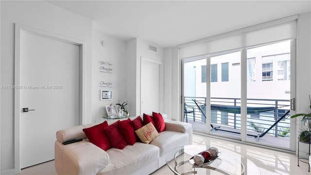 7875 NW 107th Ave Unit 511, Doral, FL 33178 - living room with a healthy amount of sunlight and visible vents