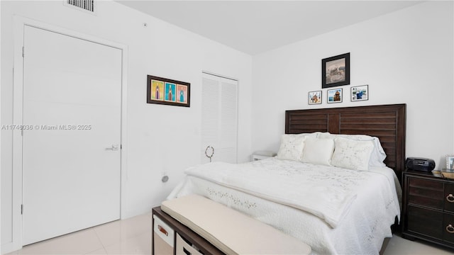 7875 NW 107th Ave Unit 511, Doral, FL 33178 - bedroom featuring a closet, light tile patterned flooring, and visible vents