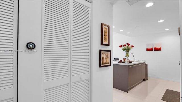 7875 NW 107th Ave Unit 511, Doral, FL 33178 - corridor with light tile patterned floors, baseboards, a sink, and recessed lighting