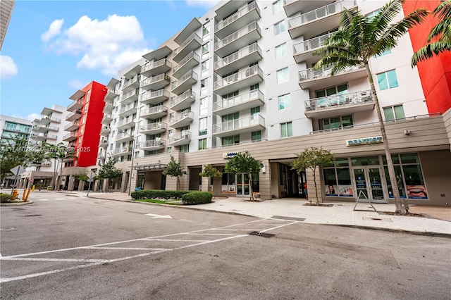 7875 NW 107th Unit 705, Doral, FL 33178 - view of property featuring uncovered parking
