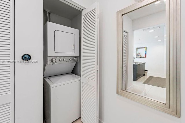 7875 NW 107th Unit 705, Doral, FL 33178 - clothes washing area with stacked washer and dryer, laundry area, and a sink