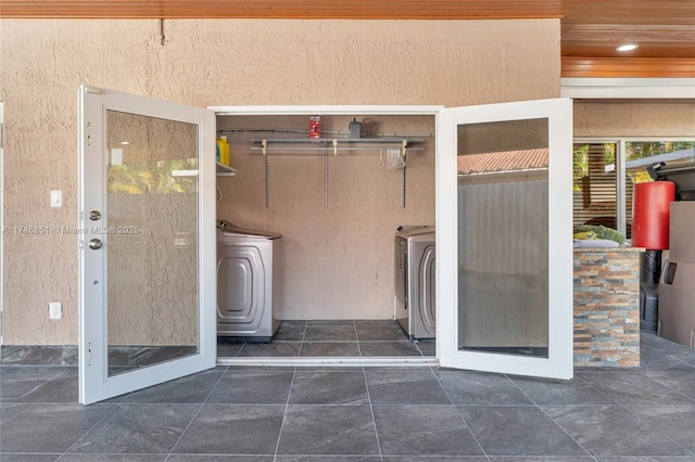 doorway to property featuring washer and clothes dryer