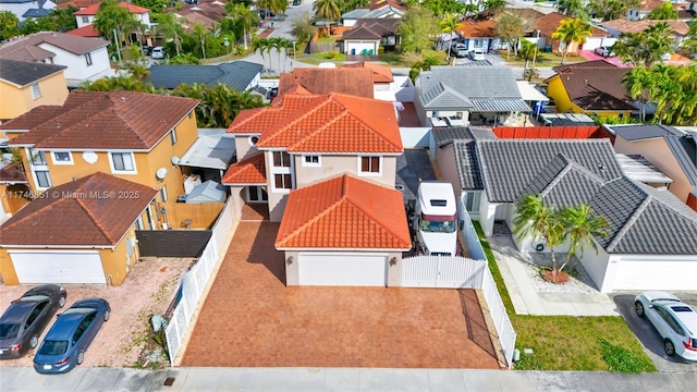 birds eye view of property with a residential view