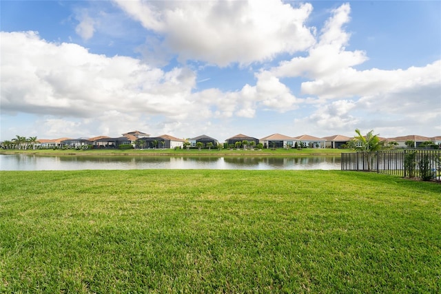 water view featuring a residential view and fence