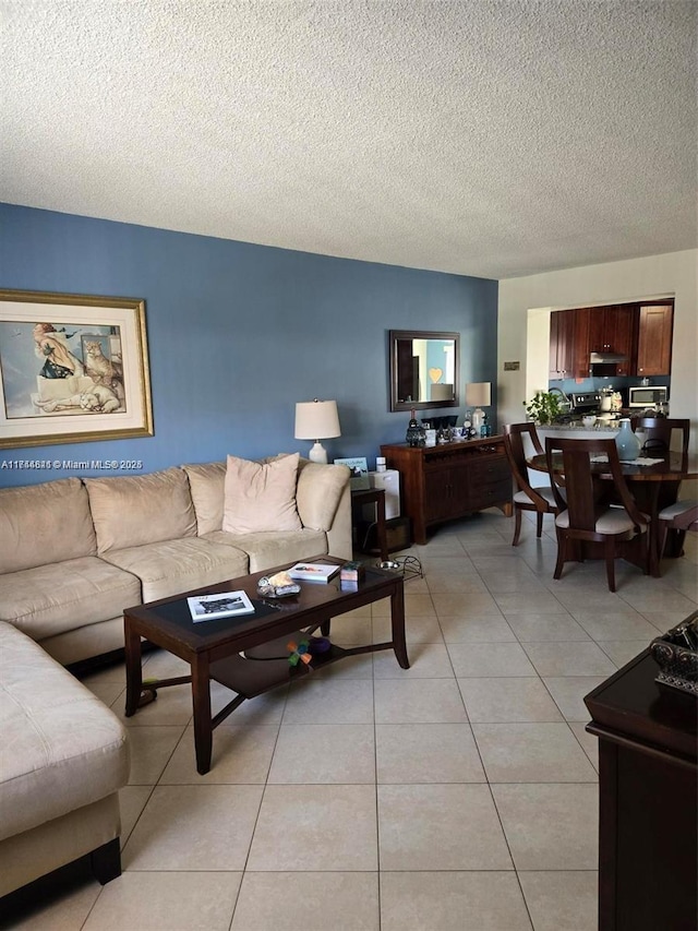 living room with light tile patterned floors and a textured ceiling