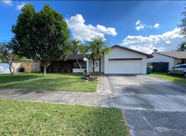 ranch-style house featuring an attached garage, driveway, a front lawn, and stucco siding