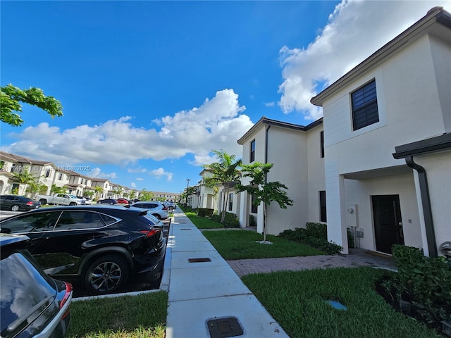 view of street with sidewalks and a residential view