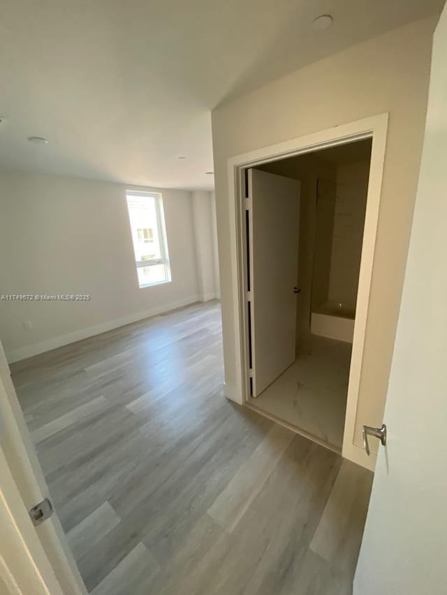 2561 NE 193rd St Unit 1202, Miami, FL 33180 - corridor with light wood finished floors and baseboards