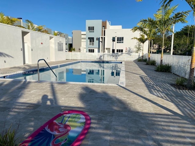 2561 NE 193rd St Unit 1202, Miami, FL 33180 - community pool with a patio area and fence