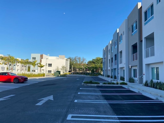2561 NE 193rd St Unit 1202, Miami, FL 33180 - uncovered parking lot featuring a residential view