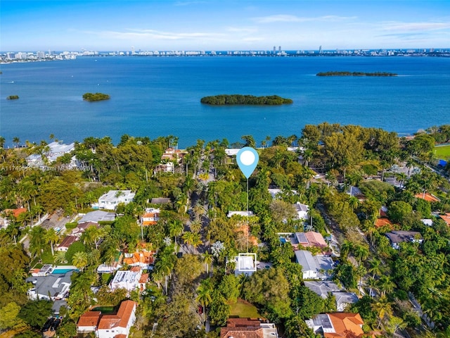 birds eye view of property with a water view and a residential view