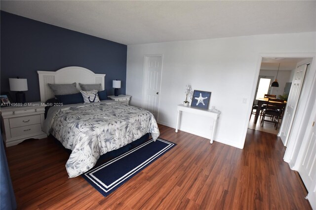 67 Berkshire Unit 67-C, West Palm Beach, FL 33417 - bedroom featuring dark wood-type flooring and baseboards