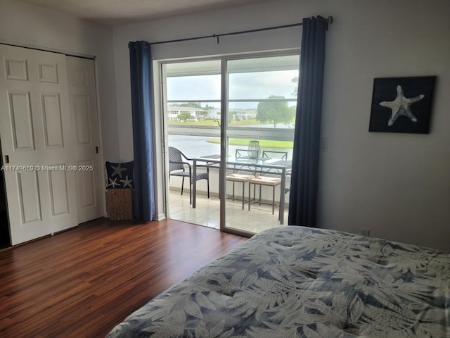 67 Berkshire Unit 67-C, West Palm Beach, FL 33417 - bedroom featuring access to exterior and dark wood-style floors