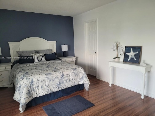 67 Berkshire Unit 67-C, West Palm Beach, FL 33417 - bedroom featuring wood finished floors and baseboards