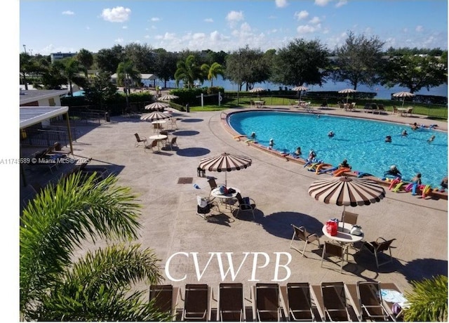 community pool with a patio area