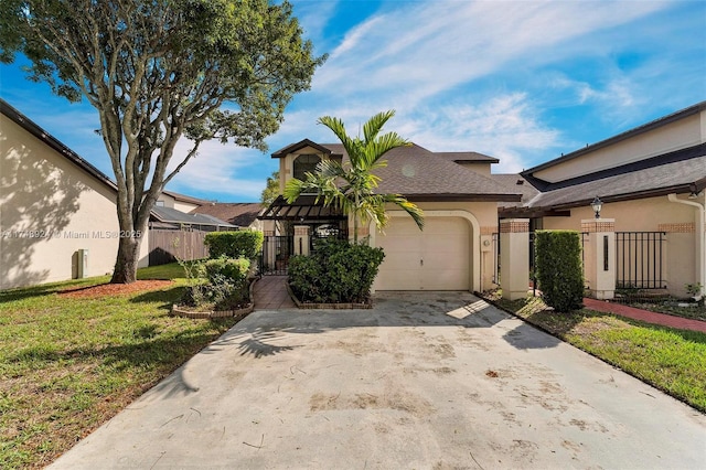 view of front of home with stucco siding, concrete driveway, an attached garage, a front yard, and fence