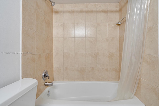 bathroom with toilet and shower / bath combination with curtain