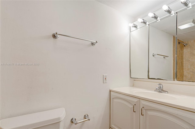 full bathroom featuring vanity and toilet