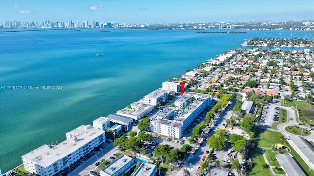 drone / aerial view with a view of city and a water view