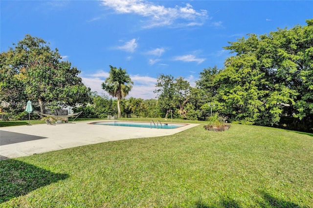 exterior space with an outdoor pool and a patio